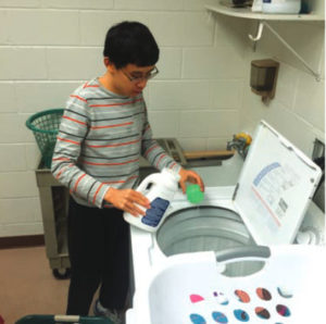 student doing laundry