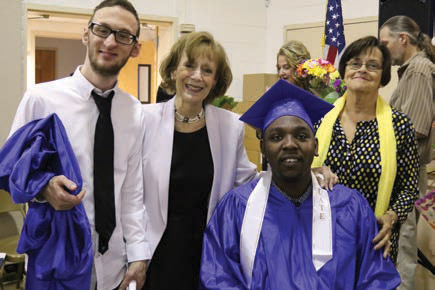 Graduates Kyle R. (far left) and Darnail T. (center right) pose proudly with Executive Director Susan Weiner (center left), and Assemblywoman and Larc Board Member Patricia Egan-Jones (far right).