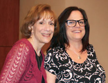 Executive Director Susan Weiner, left, honors Classroom Assistant Cathy Monti for 30 years with Larc School.