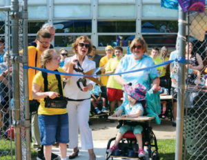 Susan Weiner cutting the dedication ribbon at the Larc Park dedication