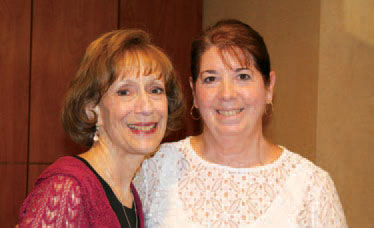 Executive Director Susan Weiner, left, congratulates Speech Therapist Roxane Adams on her 40th anniversary with Larc School.