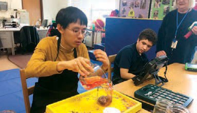 Two Larc School male students enjoying club activitities